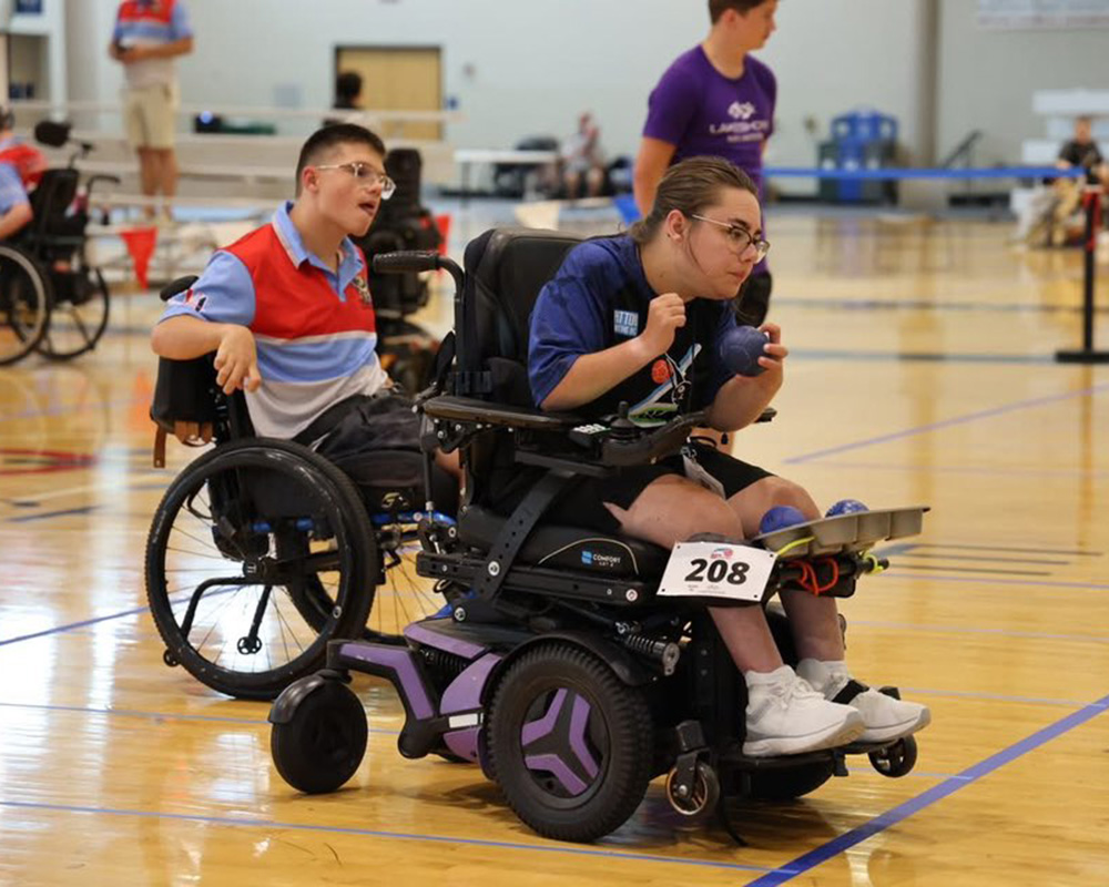 People on a court playing Boccia