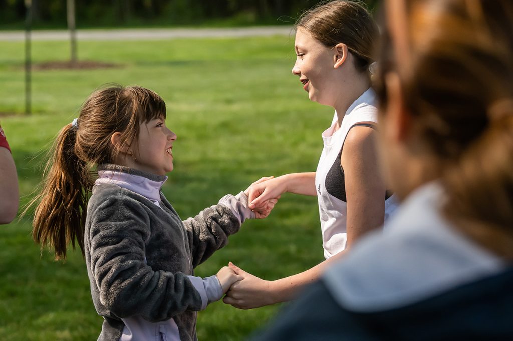 Girls holding hands dancing