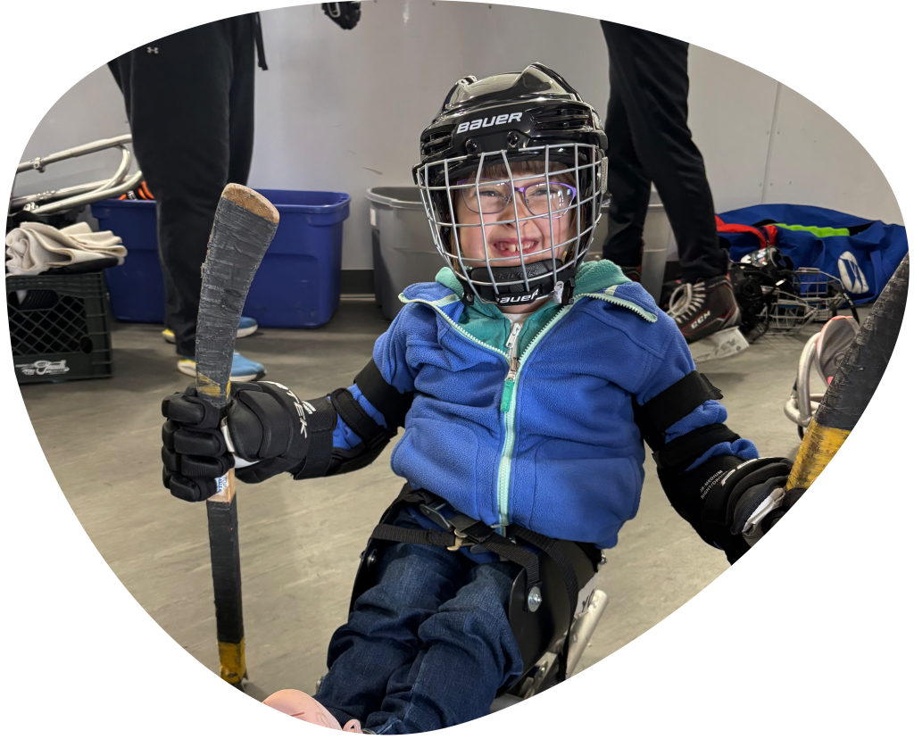 Girl with hockey equipment on