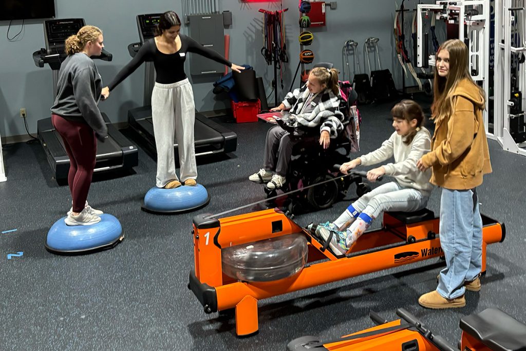 4 girls using gym equipment