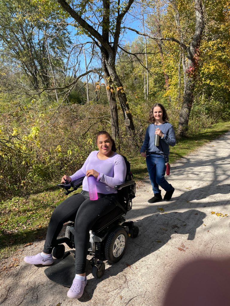 Adults walking and rolling on a nature hike