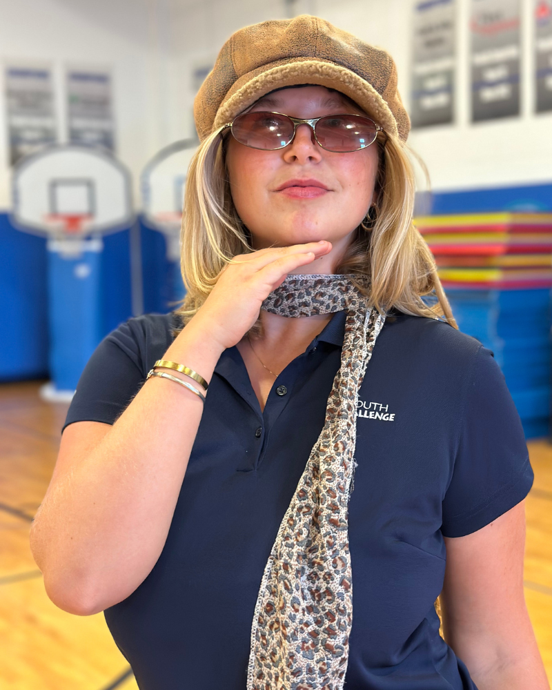 A girl dressing up with a scarf and hat