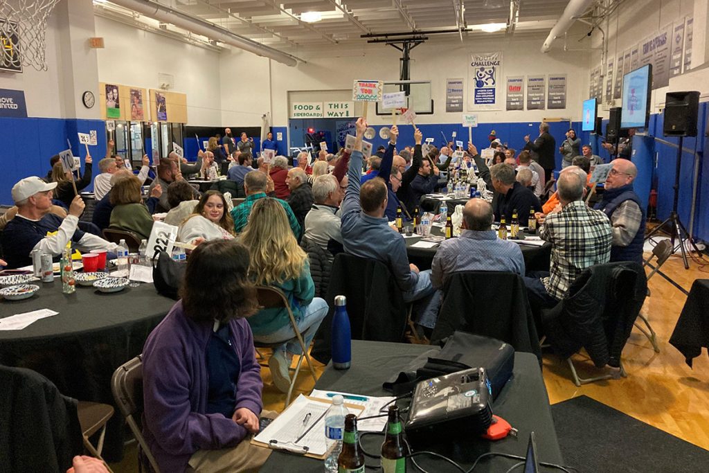 A large group of people in a basketball court
