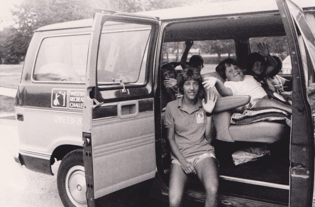 An old image of a YC van with members seated inside.