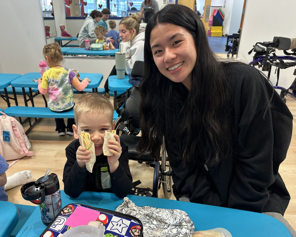 Dean and his volunteer are all smiles during lunch